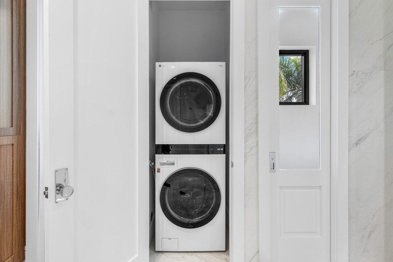 7383 Orangewood Lane, Unit 501 Boca Raton, FL 33433 - Photo 30 of 67 Primary Bathroom washer /Dryer