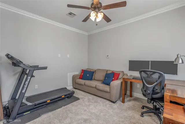 a bathroom with a granite countertop sink toilet and mirror