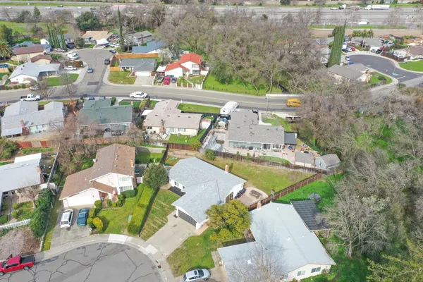 an aerial view of a house with outdoor space
