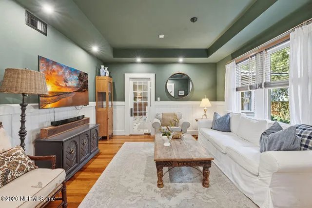 a kitchen with granite countertop a stove sink and cabinets