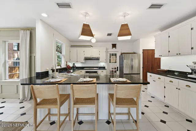 a bedroom with a bed furniture and a window