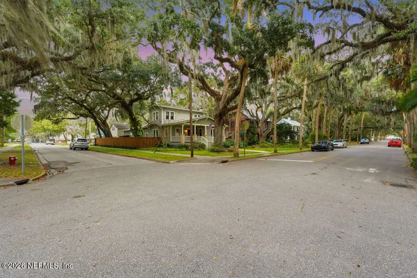 a view of road with large trees