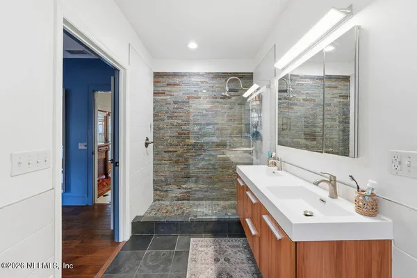 a backyard of a house with table and chairs