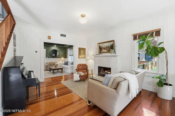 a kitchen with granite countertop a stove a sink and a refrigerator
