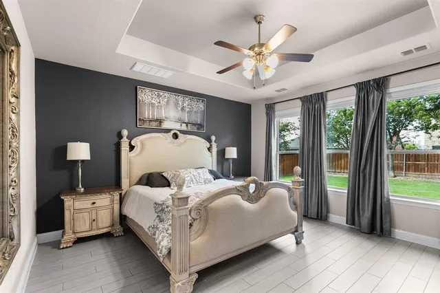 a bed room with a bed and a chandelier