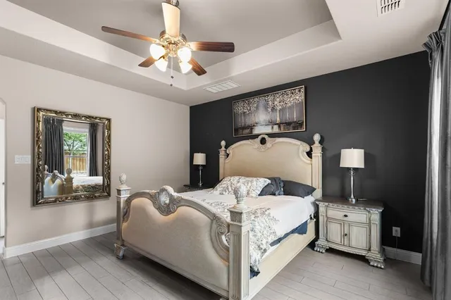 a bedroom with bed and window