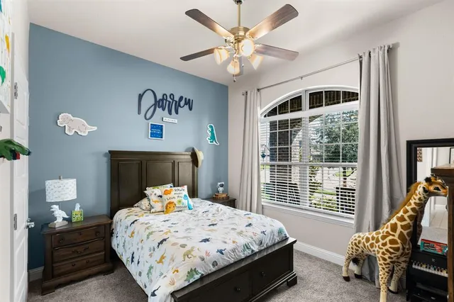 a bedroom with bed and window