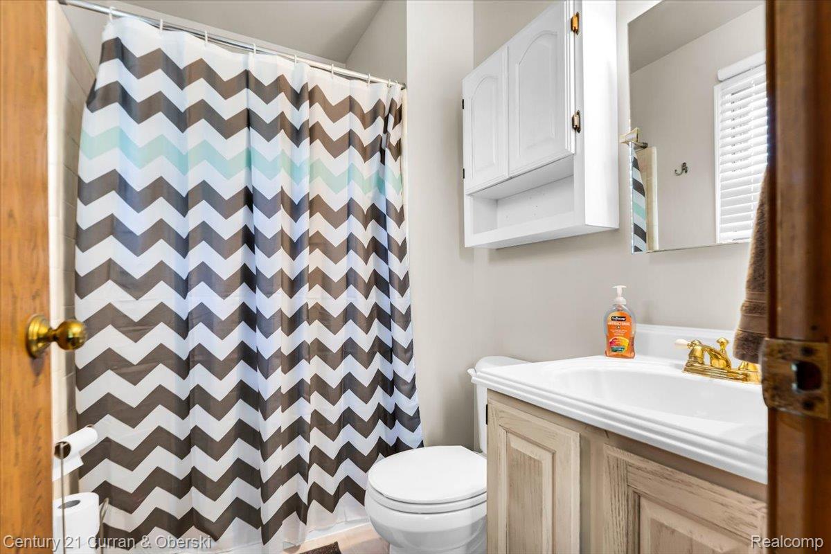 21439 Hall Road Trenton, MI 48183 - Photo 17 of 35 Primary full bathroom with a walk in shower