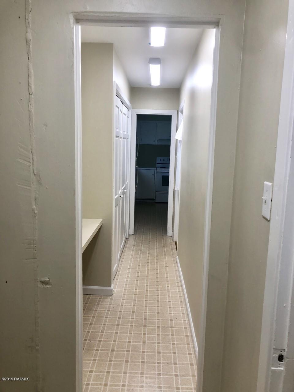 118 Normandy Road Lafayette, LA 70503 - Photo 13 of 13 118 Normandy Laundry office hall