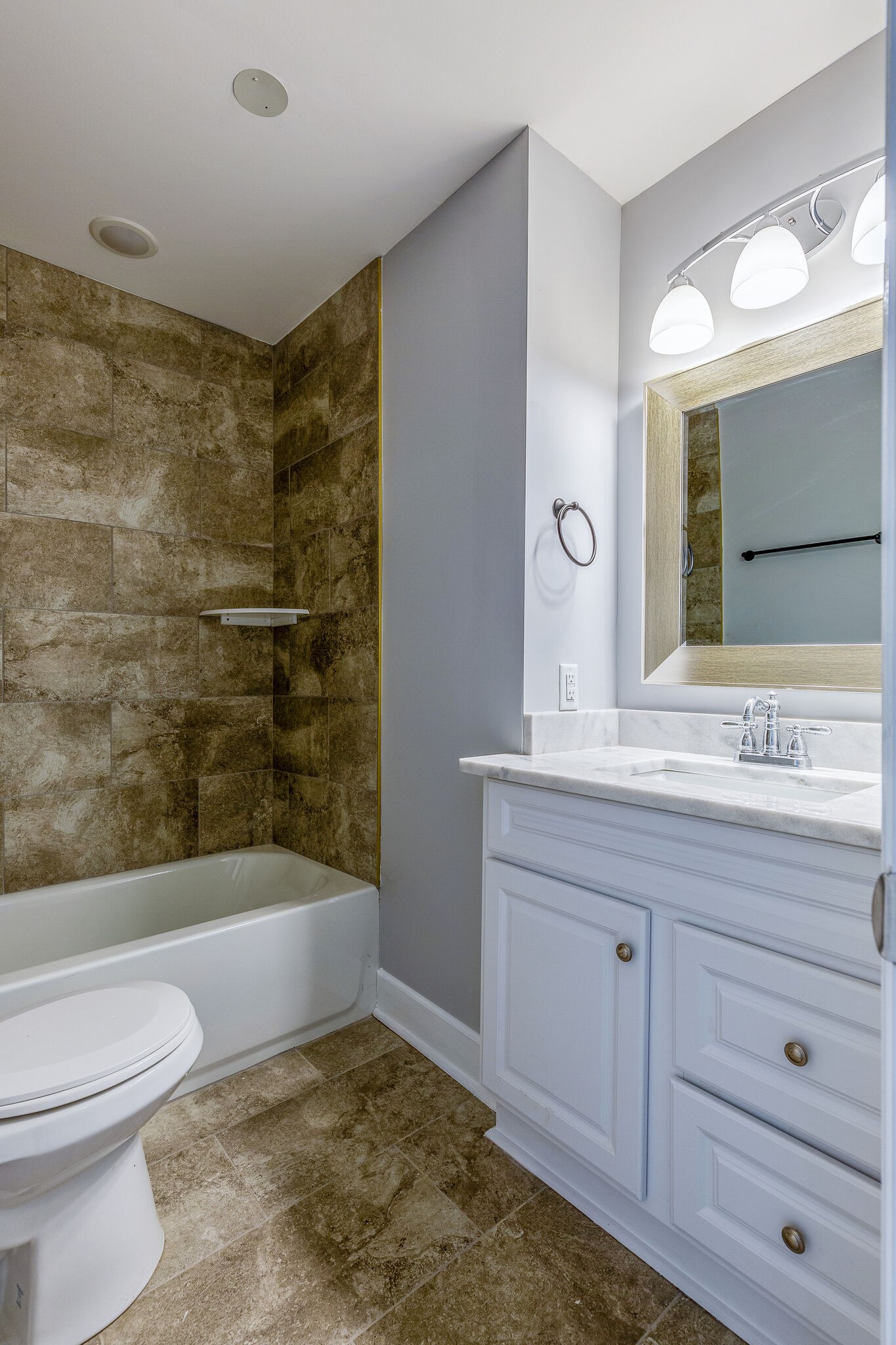 75 Benzing Road Antioch, TN 37013 - Photo 16 of 23 a bathroom with a granite countertop sink a toilet and bathtub