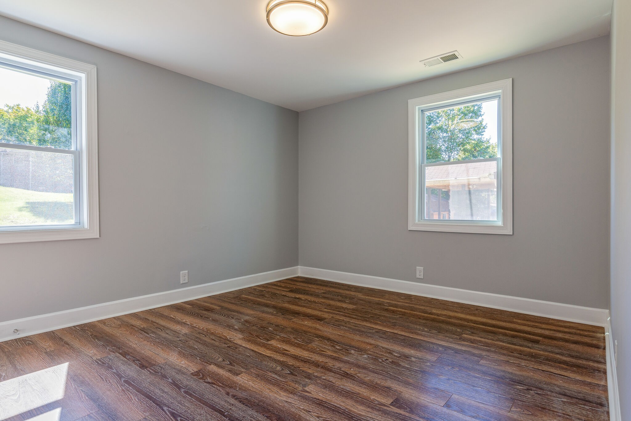 75 Benzing Road Antioch, TN 37013 - Photo 17 of 23 a view of a room with wooden floor and windows
