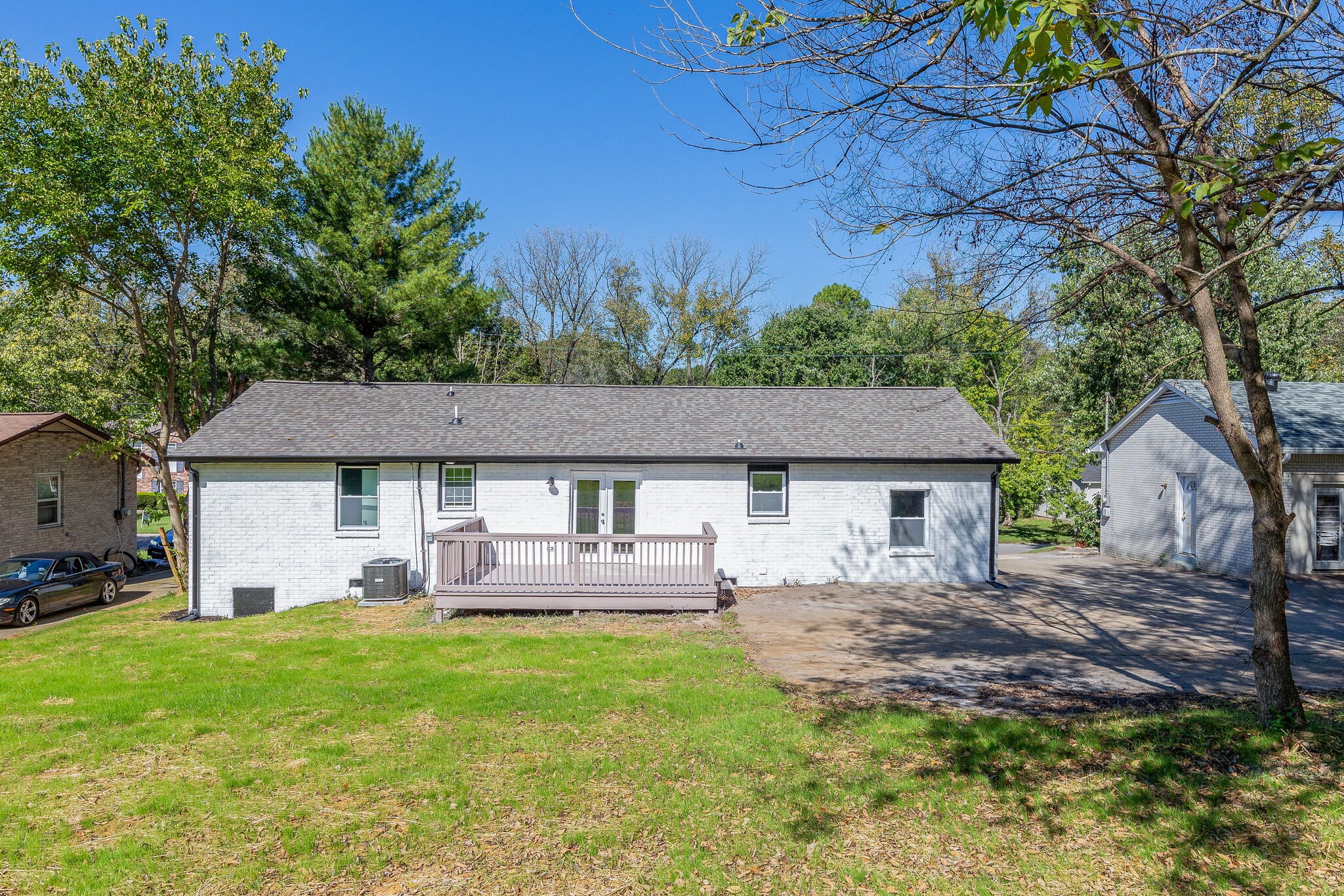 75 Benzing Road Antioch, TN 37013 - Photo 21 of 23 a front view of a house with a garden and yard