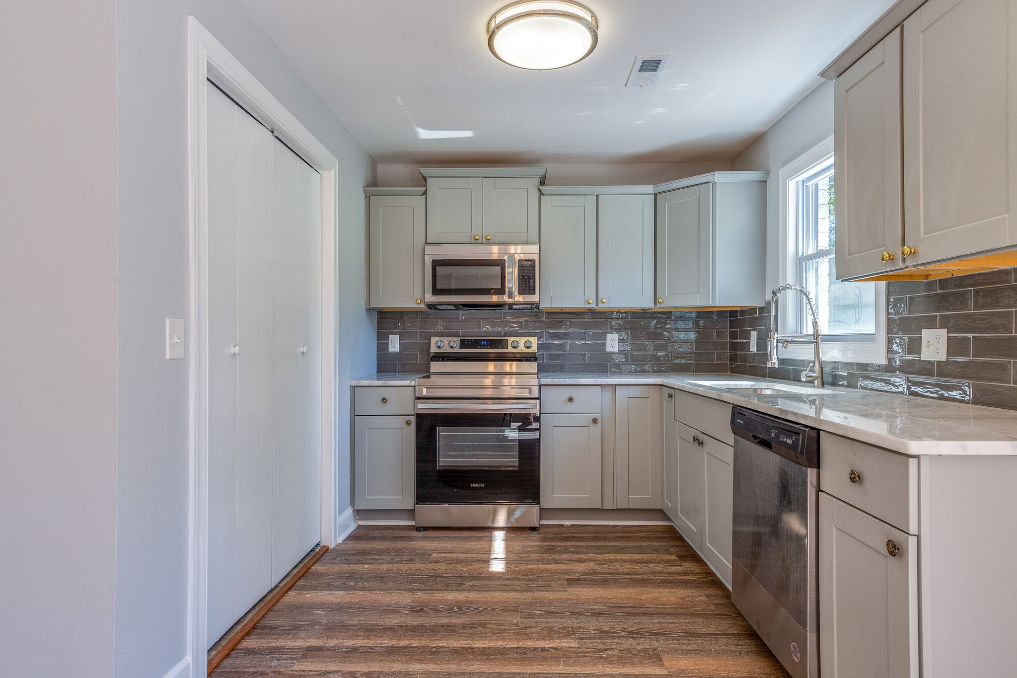75 Benzing Road Antioch, TN 37013 - Photo 5 of 23 a kitchen with stainless steel appliances granite countertop a stove top oven a sink and dishwasher