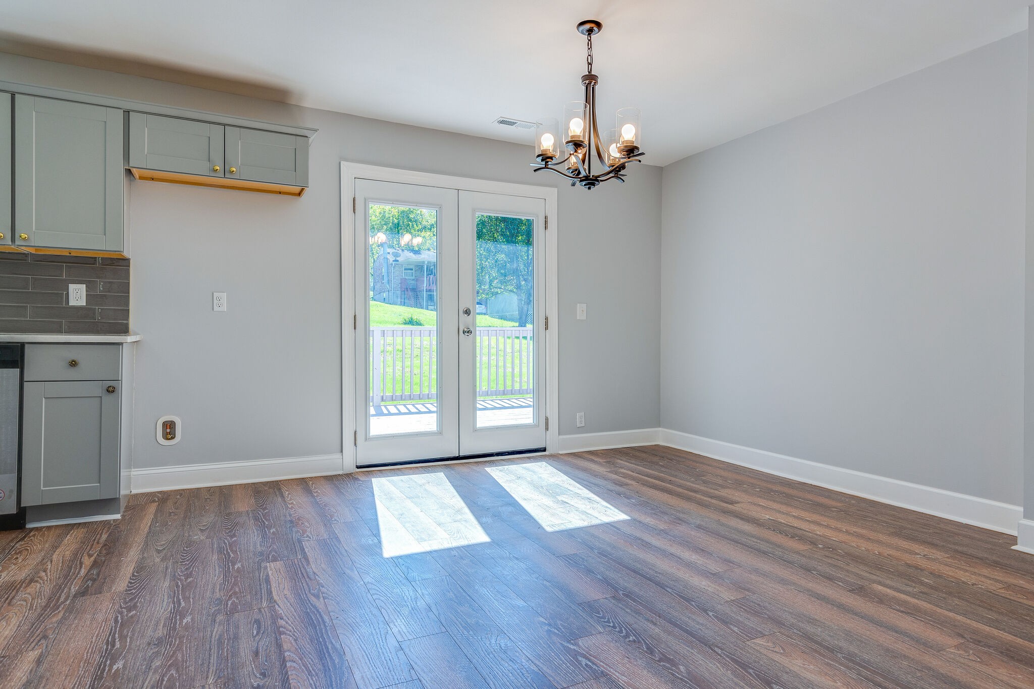 75 Benzing Road Antioch, TN 37013 - Photo 7 of 23 a view of an empty room with wooden floor and a window
