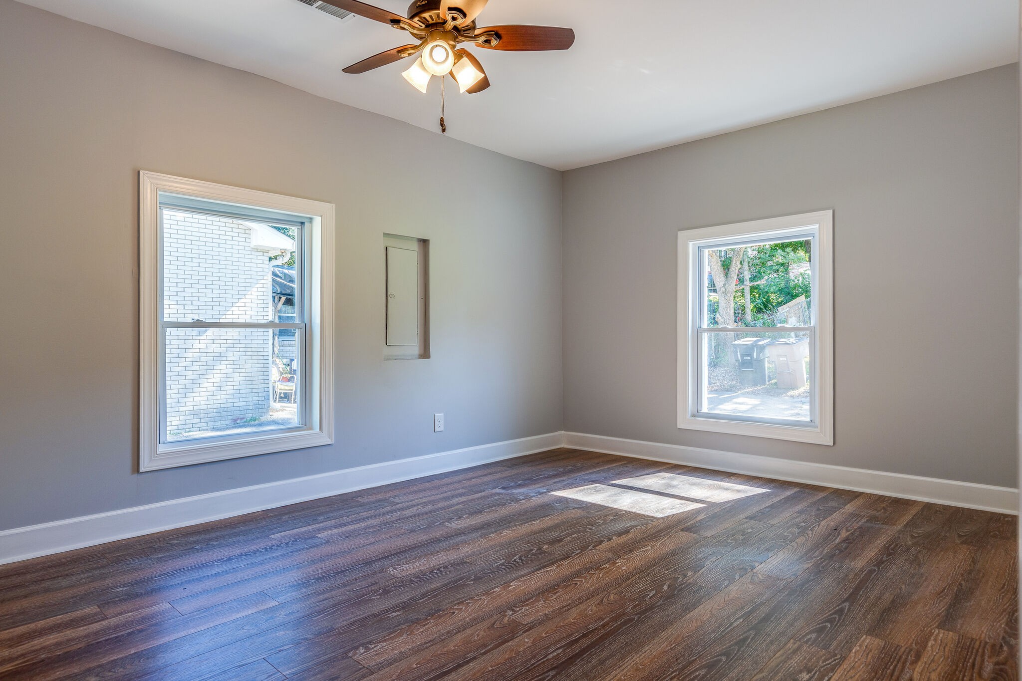 75 Benzing Road Antioch, TN 37013 - Photo 9 of 23 a view of an empty room with wooden floor and a window