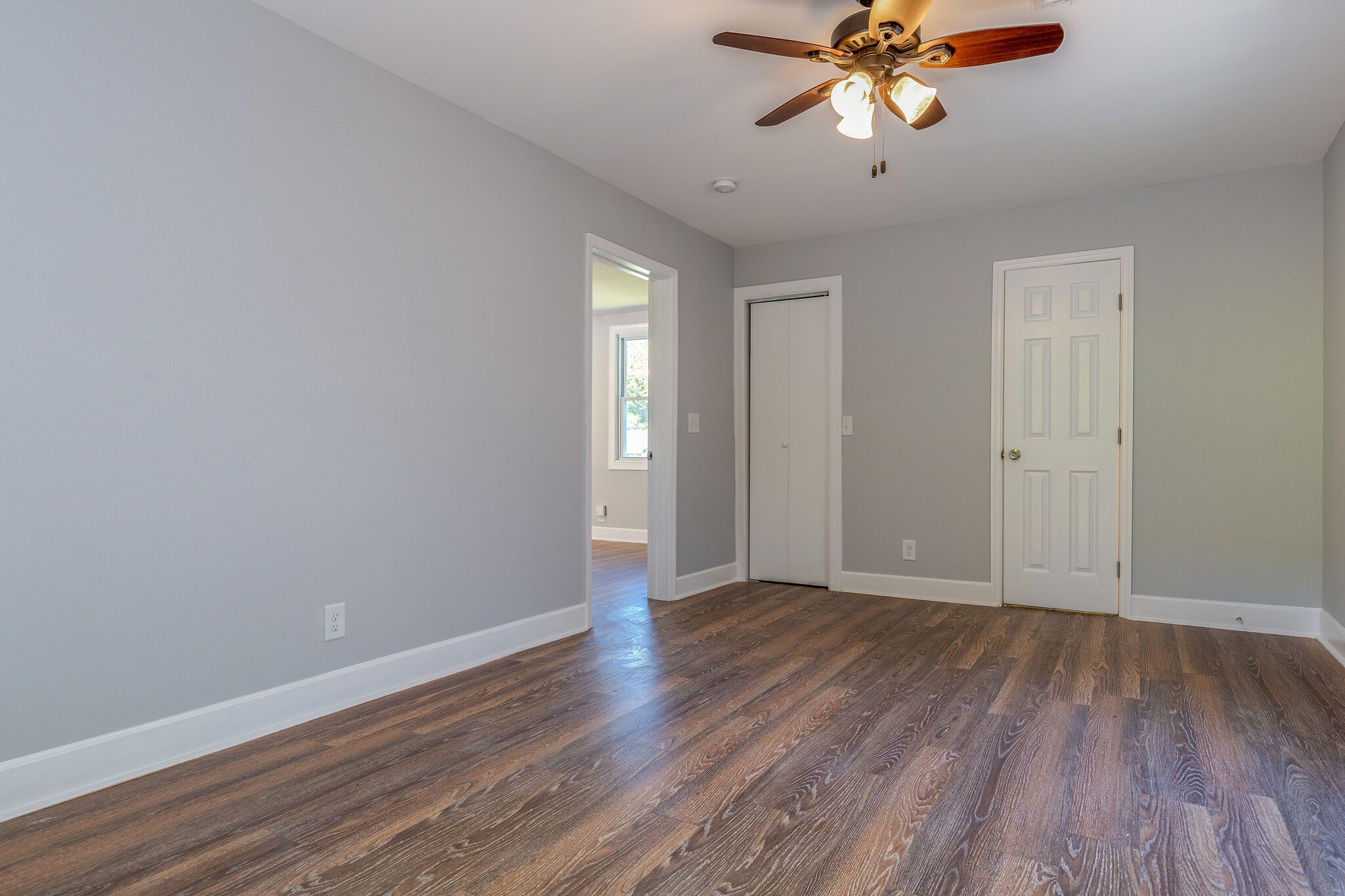 75 Benzing Road Antioch, TN 37013 - Photo 10 of 23 a view of an empty room with wooden floor and a window
