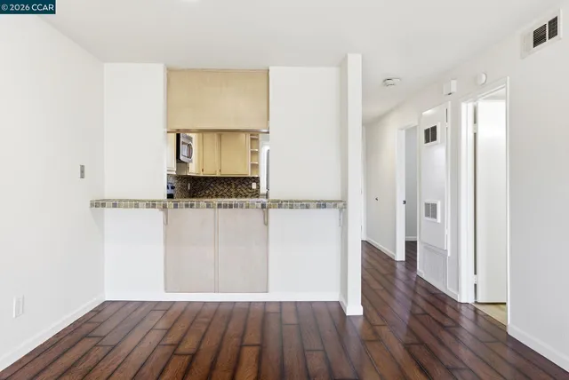 a view of hallway with wooden floor