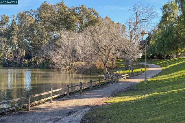 a view of a lake with a house in the background