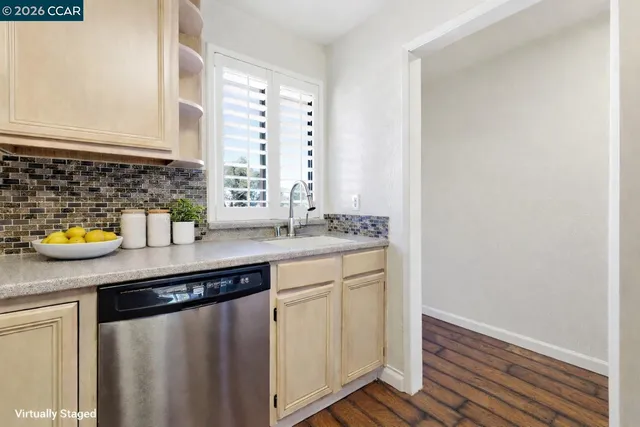 a kitchen with stainless steel appliances granite countertop a sink and a counter space