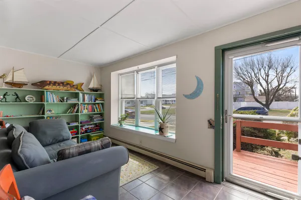 a living room with furniture and a window