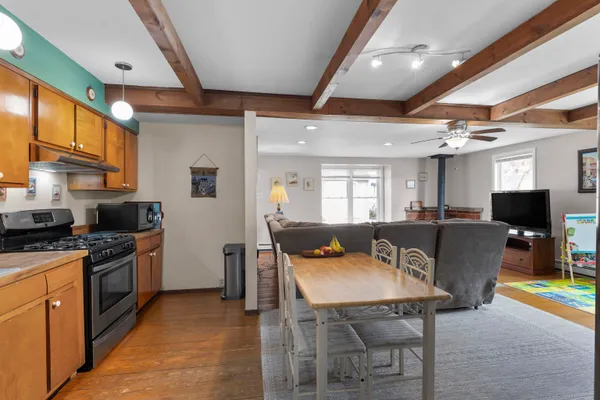 a kitchen with stainless steel appliances granite countertop a stove and a sink