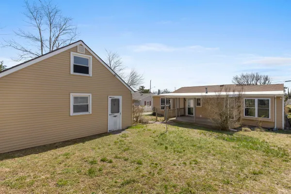 a view of a house with wooden deck