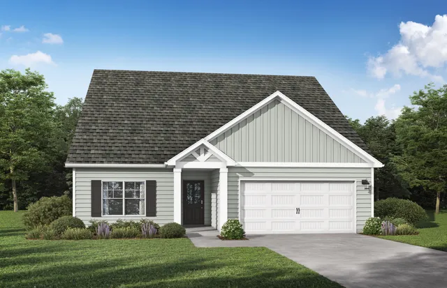 a view of a house with a yard and garage