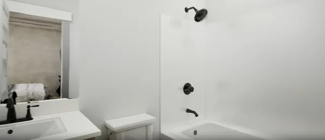 a bathroom with a sink and a toilet