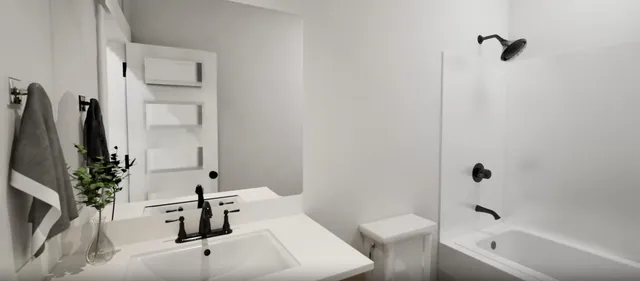 a bathroom with a tub sink and mirror