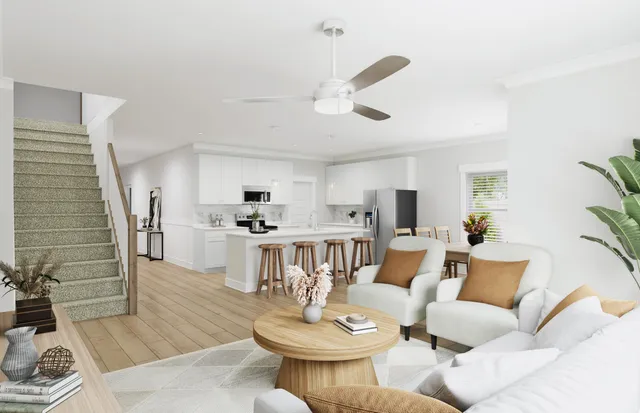 a living room with fireplace furniture and a wooden floor