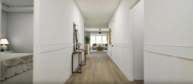 a view of a bedroom from a hallway