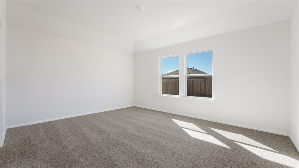 14021 Feinstein Street Manor, TX 78653 - Photo 13 of 25 A quiet retreat with a neutral carpet, perfect for personalizing to your taste.