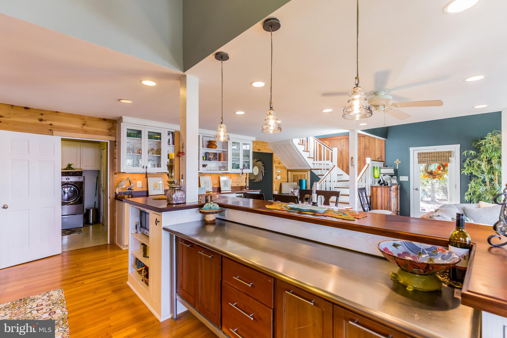 6155 Hallowing Point Road Prince Frederick, MD 20678 - Photo 13 of 29 a large kitchen with kitchen island a large counter space and stainless steel appliances