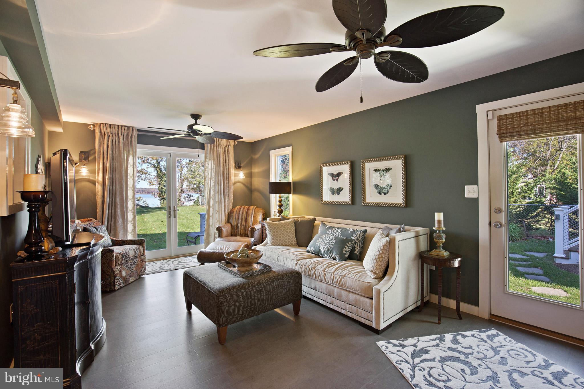 6155 Hallowing Point Road Prince Frederick, MD 20678 - Photo 15 of 29 a living room with furniture ceiling fan and a window
