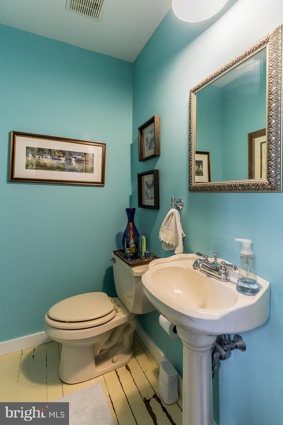 6155 Hallowing Point Road Prince Frederick, MD 20678 - Photo 20 of 29 a bathroom with a toilet sink and mirror