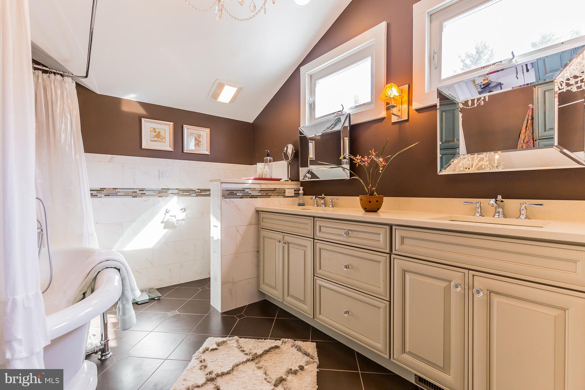 6155 Hallowing Point Road Prince Frederick, MD 20678 - Photo 25 of 29 a spacious bathroom with a double vanity sink a mirror and a