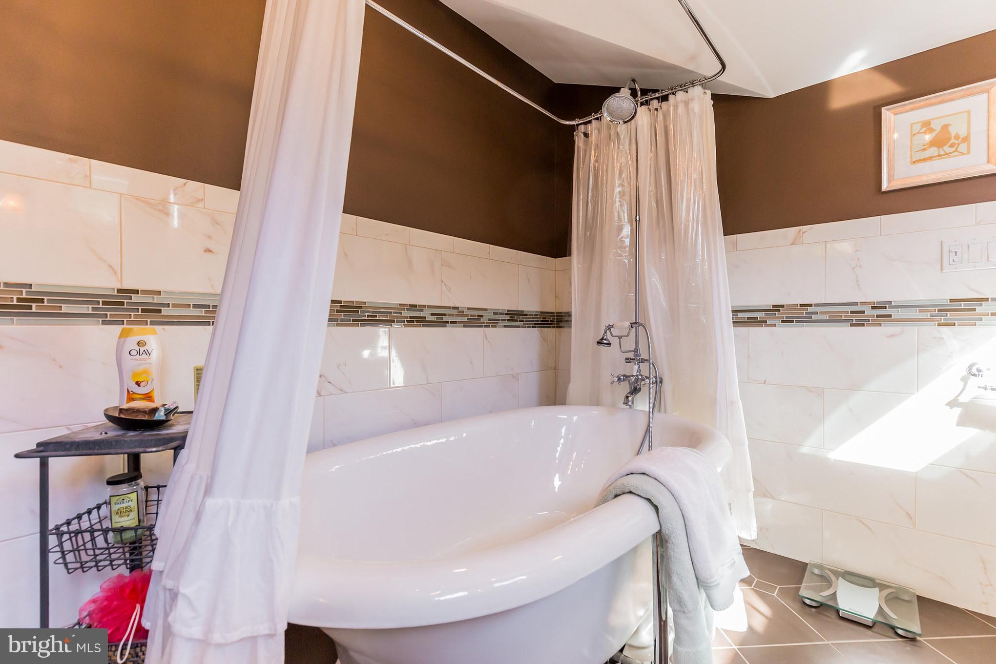 6155 Hallowing Point Road Prince Frederick, MD 20678 - Photo 26 of 29 a bathroom with a bathtub and a shower