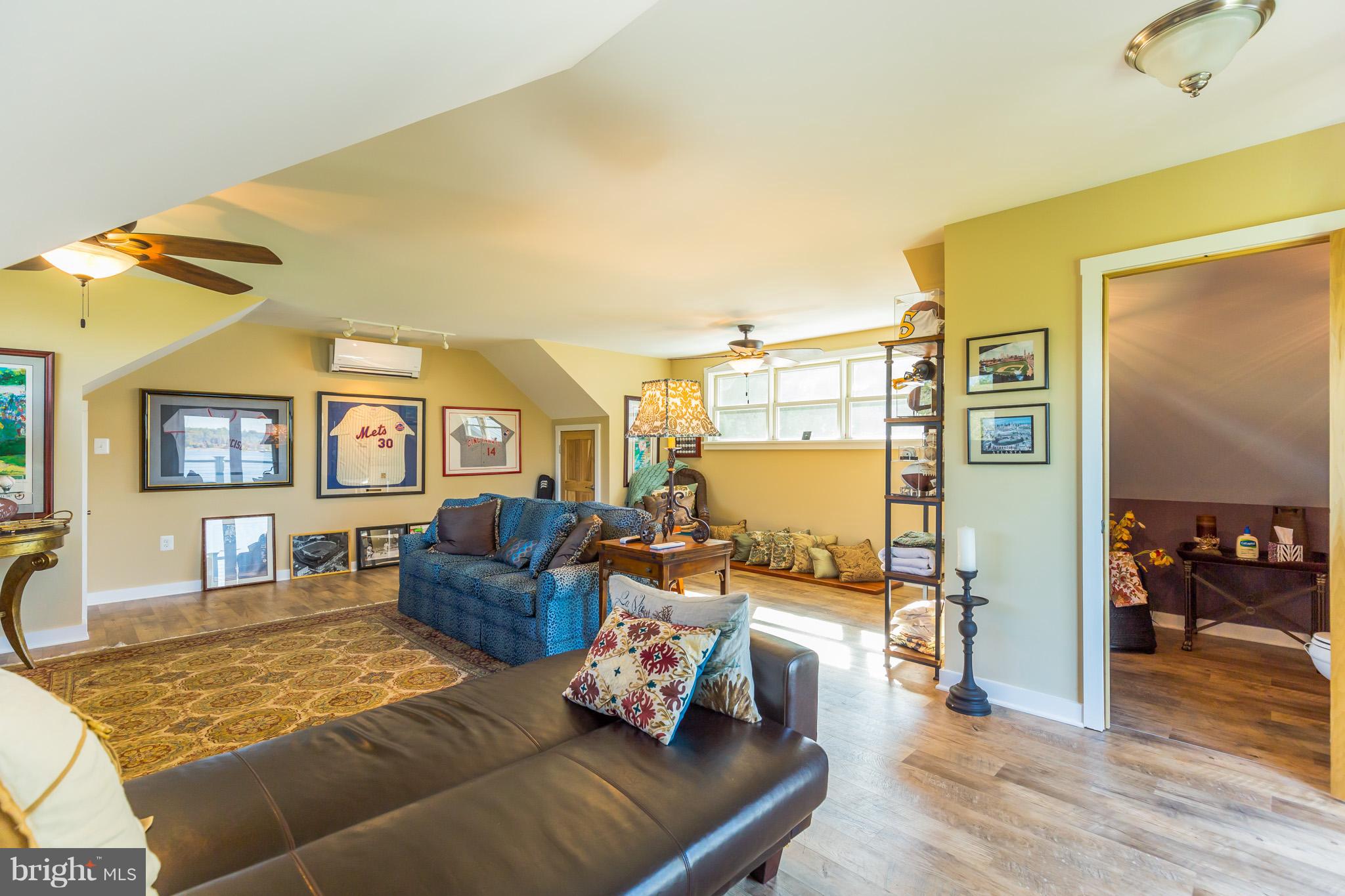 6155 Hallowing Point Road Prince Frederick, MD 20678 - Photo 28 of 29 a living room with furniture and a wooden floor
