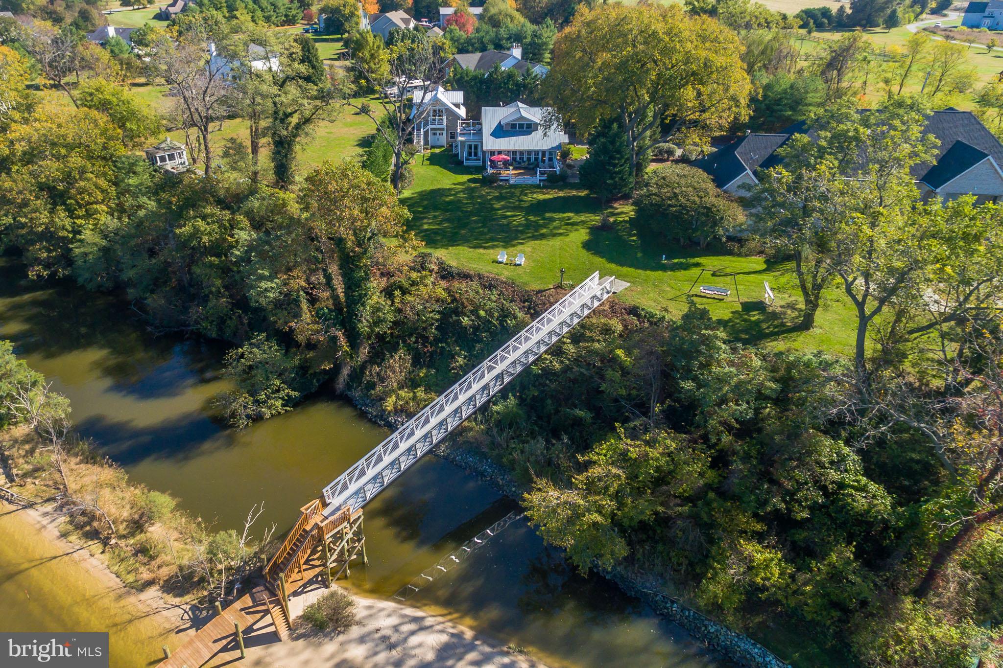 6155 Hallowing Point Road Prince Frederick, MD 20678 - Photo 6 of 29 a view of a lake with a house in a yard