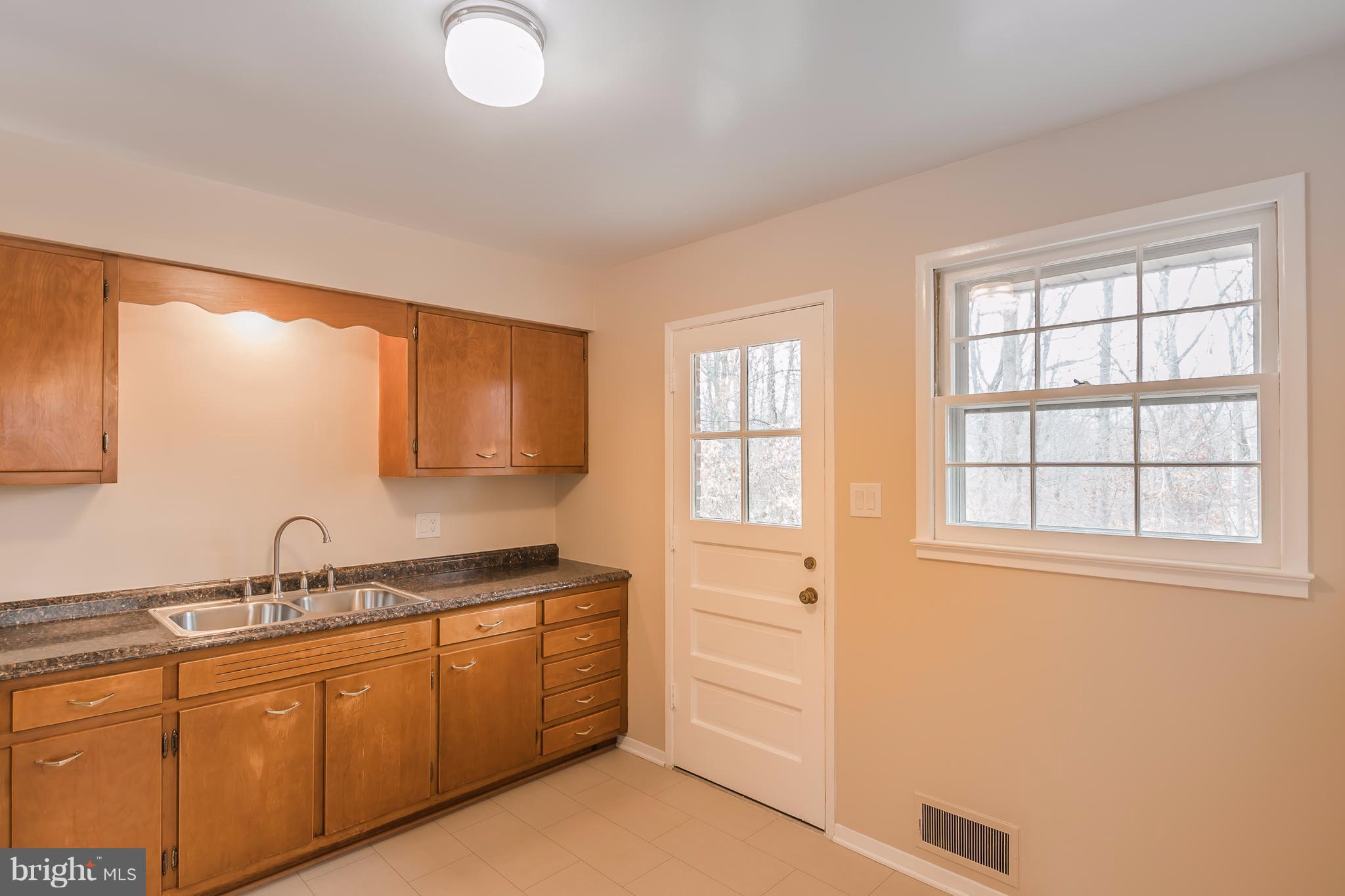 5506 Inverchapel Road Springfield, VA 22151 - Photo 13 of 29 Kitchen with Door Leading to Deck