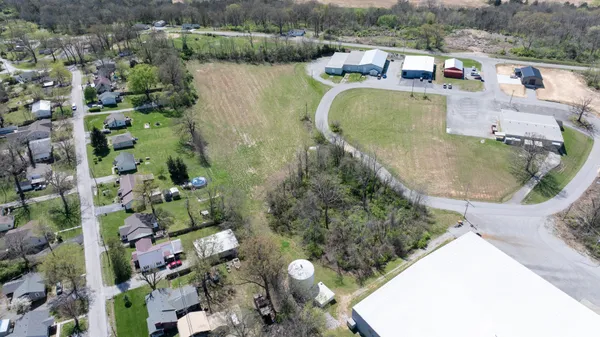 an aerial view of a house with outdoor space