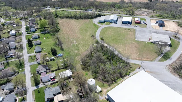 an aerial view of a house with outdoor space