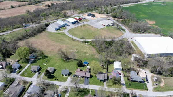 an aerial view of a house with outdoor space
