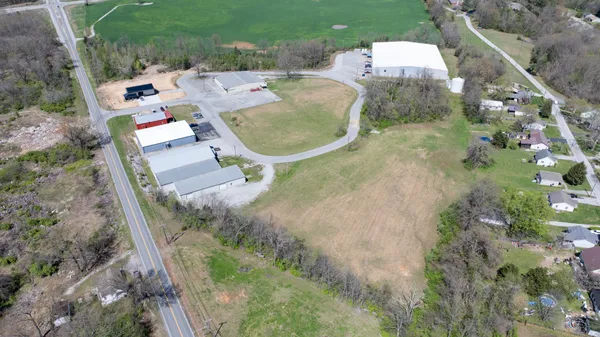 an aerial view of a house with outdoor space