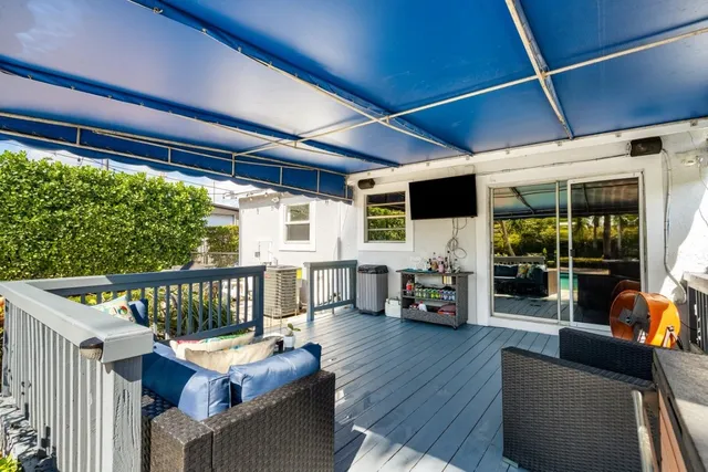 a outdoor living space with furniture and a fireplace