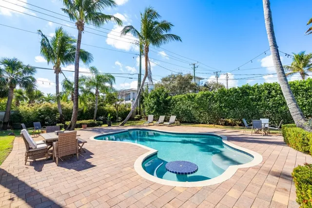 a view of swimming pool with chairs