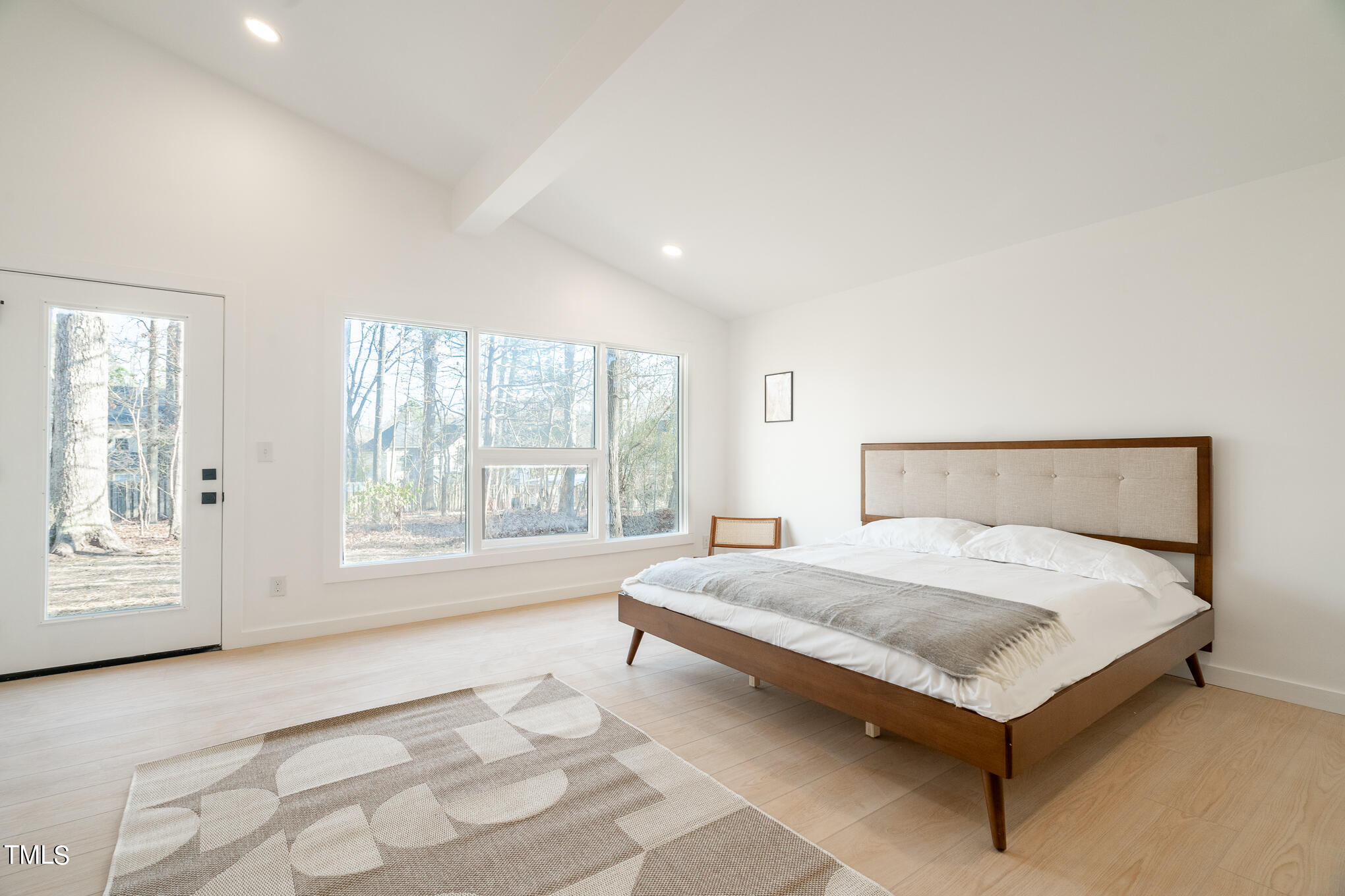 332 Erwin Road Chapel Hill, NC 27514 - Photo 20 of 35 a large bedroom with a bed and window