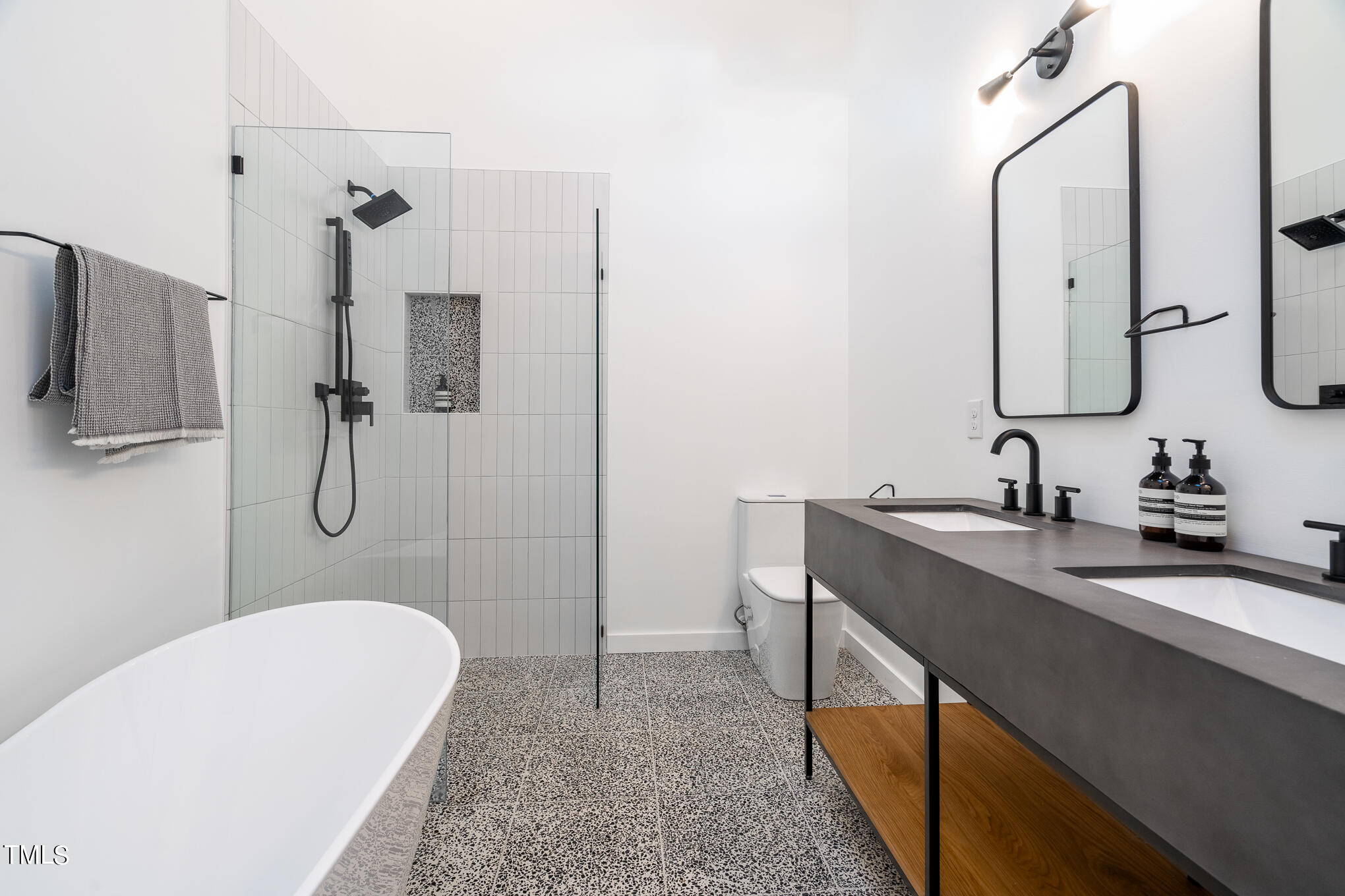332 Erwin Road Chapel Hill, NC 27514 - Photo 23 of 35 a bathroom with a double vanity sink a mirror and shower