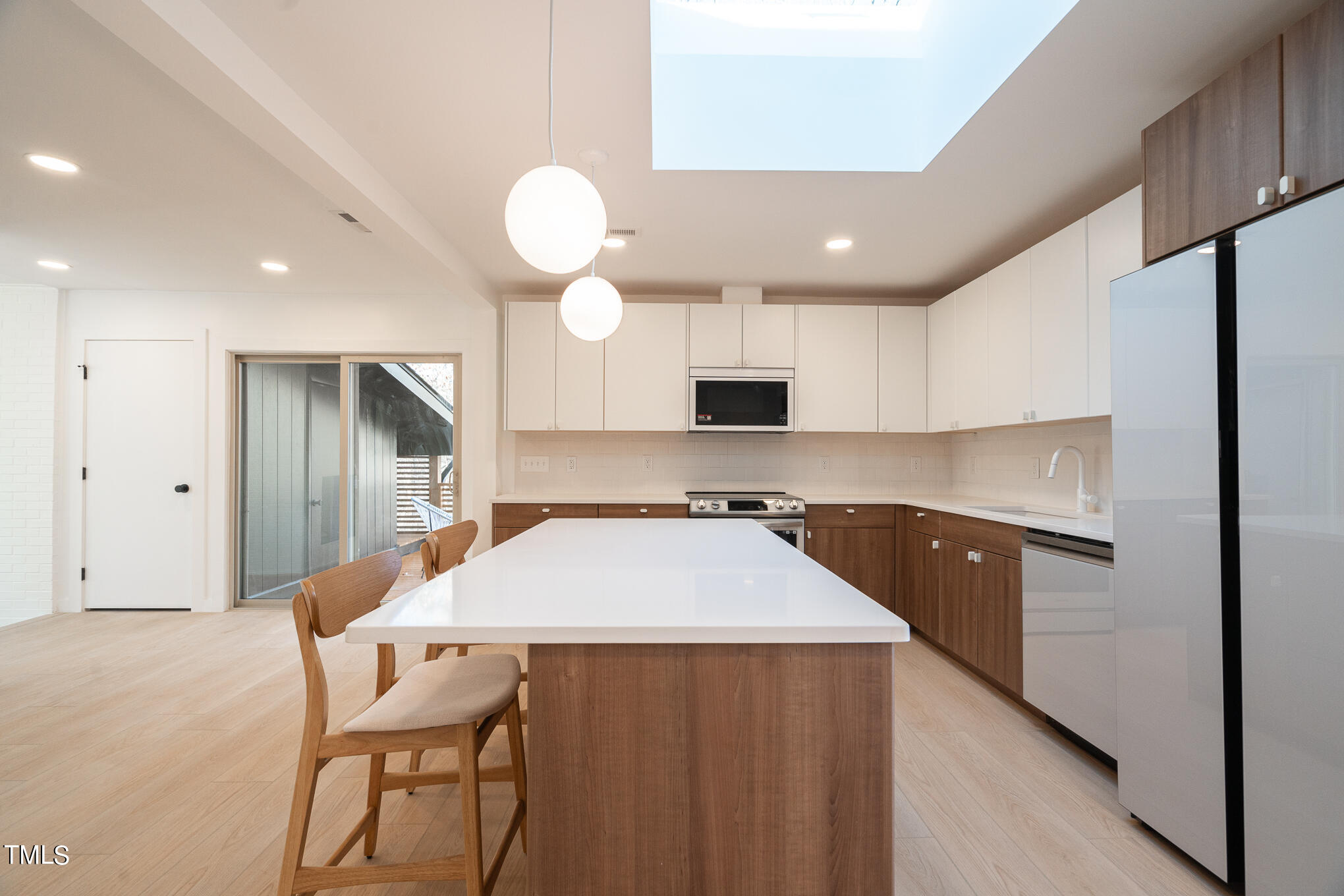 332 Erwin Road Chapel Hill, NC 27514 - Photo 7 of 35 a kitchen with stainless steel appliances granite countertop a sink refrigerator and cabinets