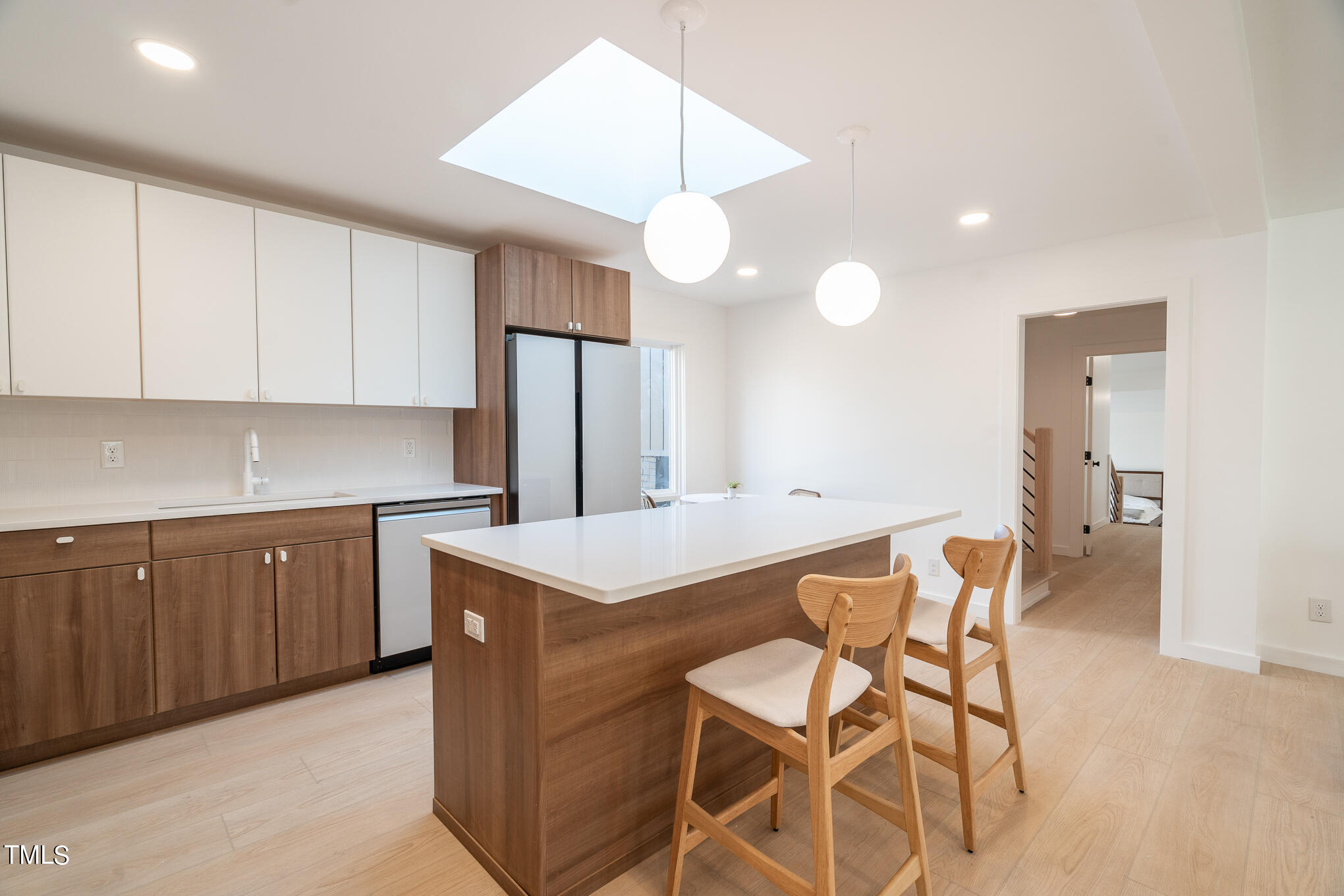 332 Erwin Road Chapel Hill, NC 27514 - Photo 8 of 35 a kitchen with a dining table chairs cabinets and stainless steel appliances